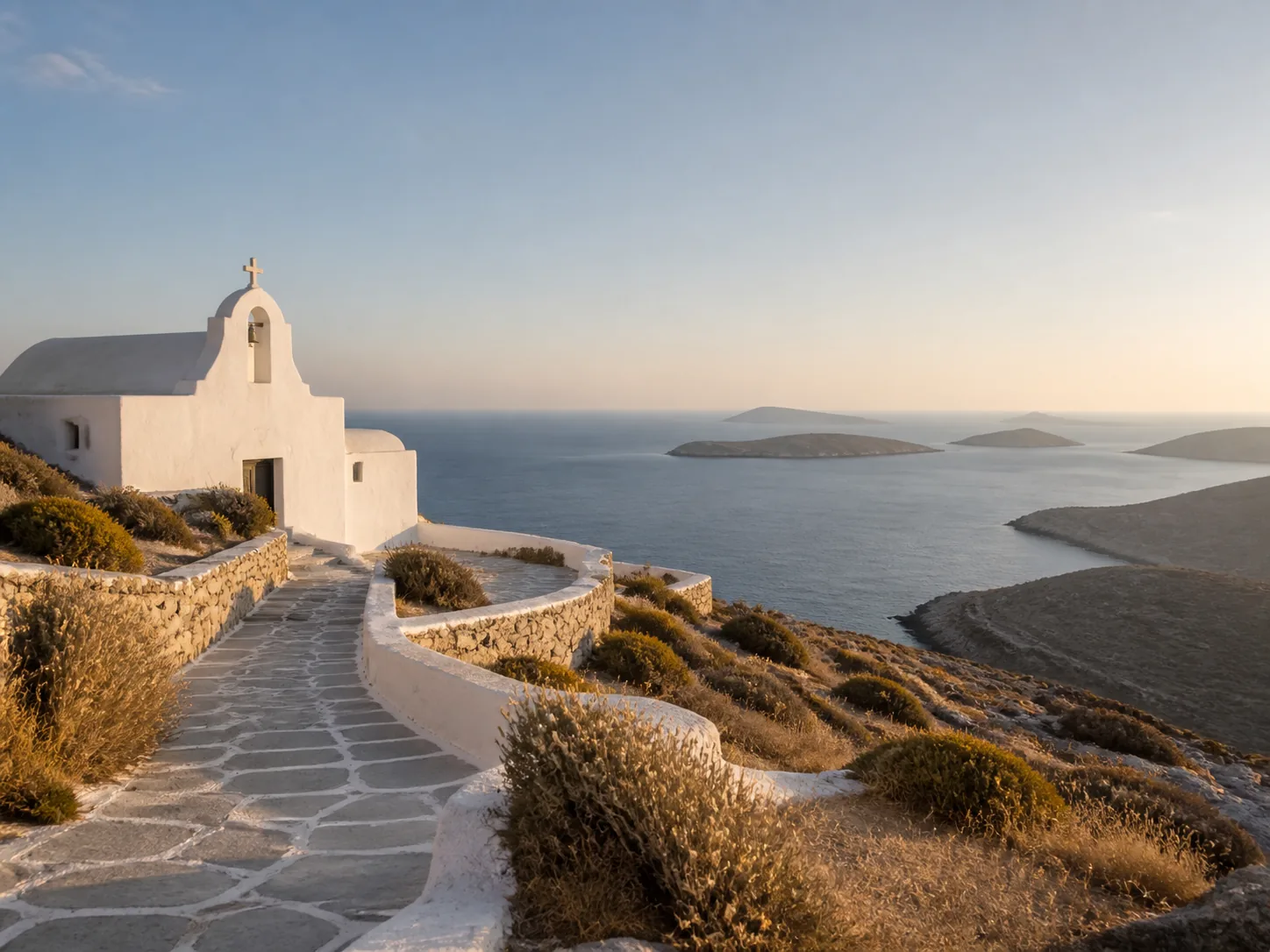 A blue-domed chapel above the Aegean